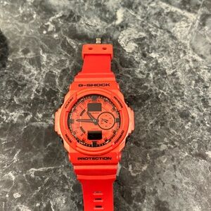 Men’s G-Shock watch like new burnt orange color round face